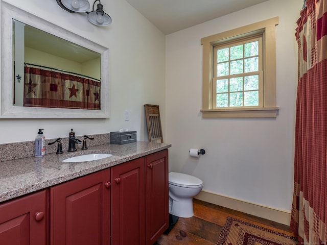 332 Good Hill Rd, Woodbury, CT 06798 - full bath with wood finished floors, toilet, vanity, and baseboards
