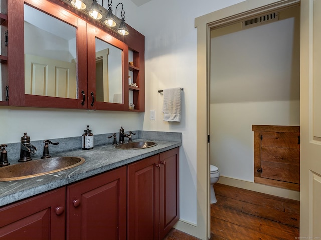 332 Good Hill Rd, Woodbury, CT 06798 - bathroom featuring toilet, double vanity, and wood finished floors