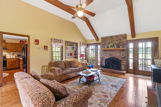 19 Edgewood St, Cromwell, CT 06416 - living area with light wood-style floors, high vaulted ceiling, ceiling fan, beam ceiling, and a brick fireplace