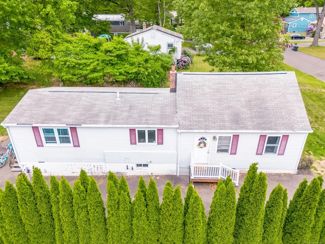40 Woodland Ave, North Haven, CT 06473 - view of front of house featuring a shingled roof and a chimney