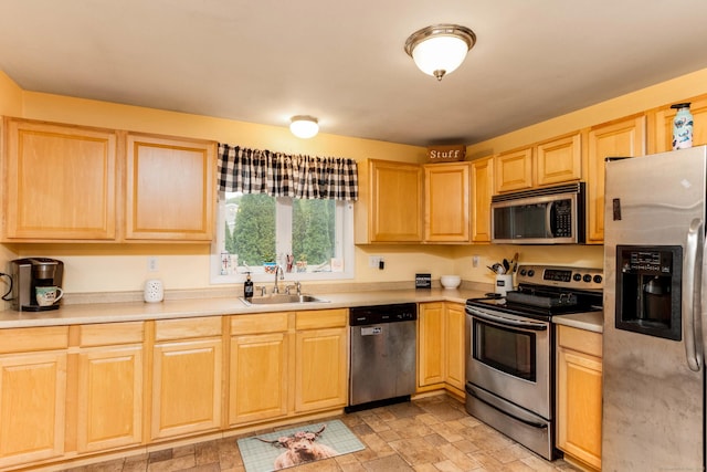 40 Woodland Ave, North Haven, CT 06473 - kitchen with stainless steel appliances, light brown cabinets, and light countertops