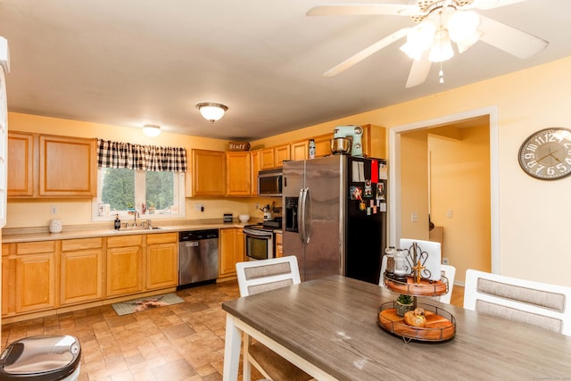 40 Woodland Ave, North Haven, CT 06473 - kitchen with appliances with stainless steel finishes, light countertops, a ceiling fan, stone finish floors, and light brown cabinets