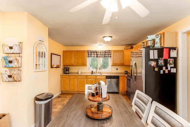 40 Woodland Ave, North Haven, CT 06473 - kitchen with appliances with stainless steel finishes, light countertops, and a ceiling fan