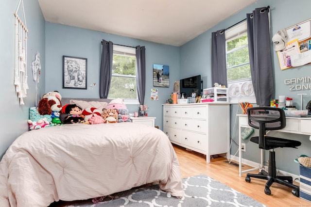 40 Woodland Ave, North Haven, CT 06473 - bedroom with multiple windows and light wood-style floors