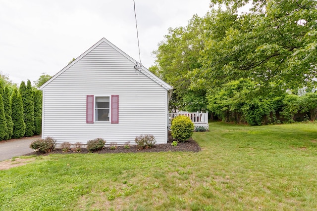 40 Woodland Ave, North Haven, CT 06473 - view of side of property with a lawn and a deck