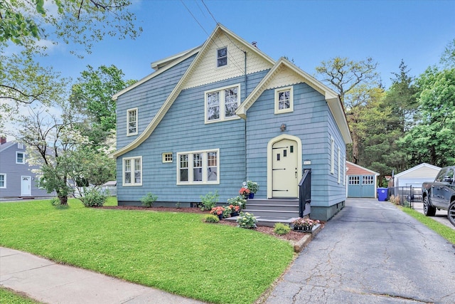 61 Reed St, Stratford, CT 06614 - view of front facade with a front lawn, an outbuilding, and entry steps