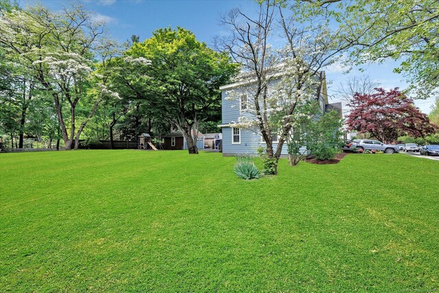 61 Reed St, Stratford, CT 06614 - view of grassy yard featuring a playground