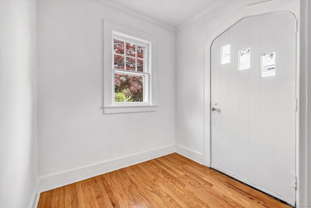 61 Reed St, Stratford, CT 06614 - entrance foyer with healthy amount of natural light, crown molding, baseboards, and light wood-style flooring