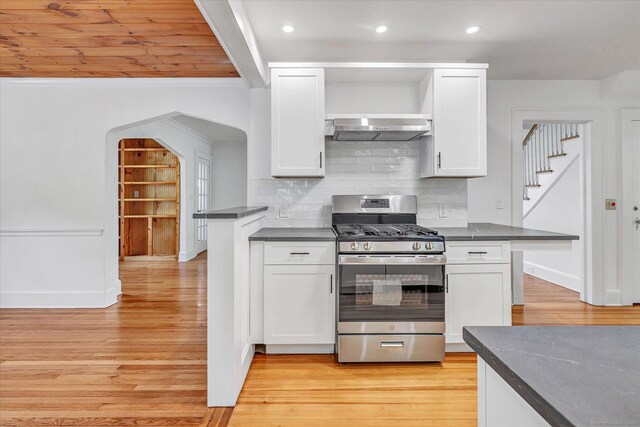 61 Reed St, Stratford, CT 06614 - kitchen featuring stainless steel gas range, range hood, dark countertops, light wood-type flooring, and recessed lighting