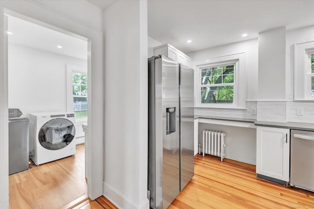 61 Reed St, Stratford, CT 06614 - kitchen with stainless steel appliances, radiator, light wood finished floors, healthy amount of natural light, and recessed lighting