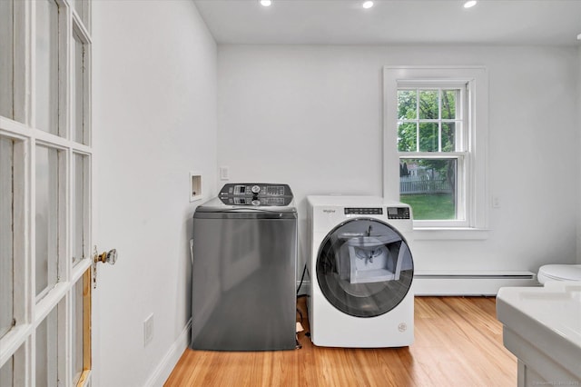 61 Reed St, Stratford, CT 06614 - clothes washing area featuring a baseboard radiator, separate washer and dryer, light wood-style floors, and recessed lighting