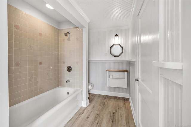 61 Reed St, Stratford, CT 06614 - full bath featuring toilet, baseboards, wood finished floors,  shower combination, and crown molding