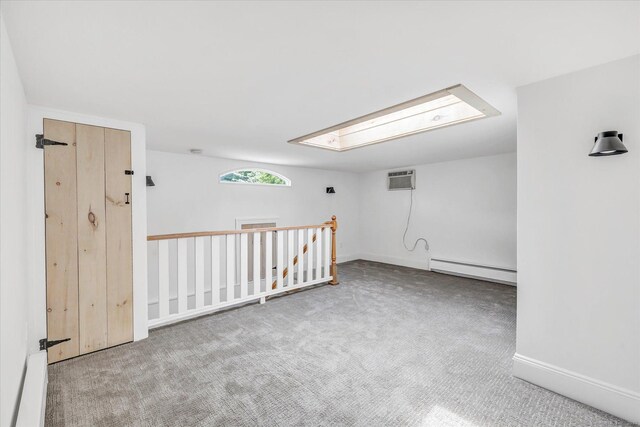 61 Reed St, Stratford, CT 06614 - additional living space featuring a baseboard heating unit, carpet floors, and baseboards