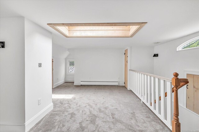 61 Reed St, Stratford, CT 06614 - hall featuring a baseboard heating unit, plenty of natural light, carpet flooring, and baseboards