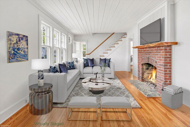 61 Reed St, Stratford, CT 06614 - living area with wood-type flooring, a brick fireplace, wooden ceiling, stairs, and ornamental molding