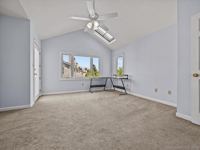 158 Paddock Ave Apt 2001, Meriden, CT 06450 - unfurnished room with a ceiling fan, carpet flooring, a skylight, lofted ceiling, and baseboards