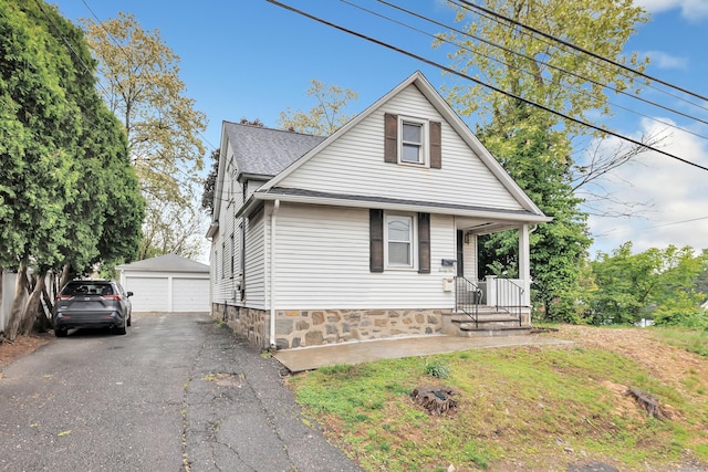 26 Longfellow Ave, Fairfield, CT 06825 - bungalow featuring a garage, an outbuilding, and a shingled roof