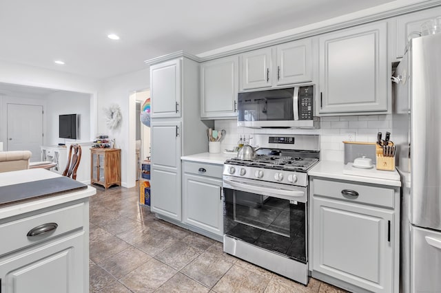 26 Longfellow Ave, Fairfield, CT 06825 - kitchen featuring appliances with stainless steel finishes, gray cabinetry, backsplash, light countertops, and recessed lighting