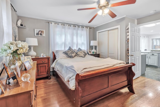 26 Longfellow Ave, Fairfield, CT 06825 - bedroom featuring ornamental molding, light wood-type flooring, a closet, a ceiling fan, and connected bathroom