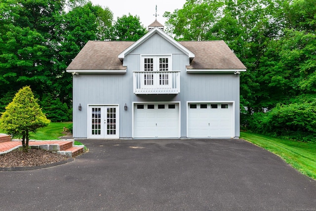 130 Haviland Rd, Ridgefield, CT 06877 - view of front of home with french doors, roof with shingles, and a detached garage
