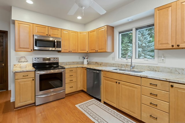 130 Haviland Rd, Ridgefield, CT 06877 - kitchen featuring appliances with stainless steel finishes, light brown cabinetry, light wood-type flooring, light stone counters, and a ceiling fan