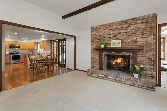 130 Haviland Rd, Ridgefield, CT 06877 - living area featuring light carpet, a baseboard radiator, a brick fireplace, and healthy amount of natural light