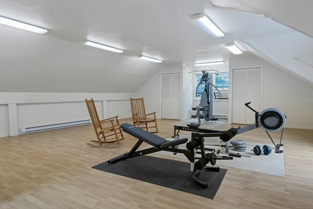 130 Haviland Rd, Ridgefield, CT 06877 - workout area featuring a baseboard heating unit, wood finished floors, and vaulted ceiling
