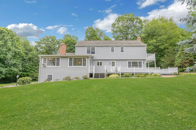 130 Haviland Rd, Ridgefield, CT 06877 - rear view of property with a chimney, a lawn, and a wooden deck