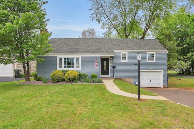 184 Goodale Dr, Newington, CT 06111 - view of front of home with asphalt driveway, a garage, a front yard, and a chimney