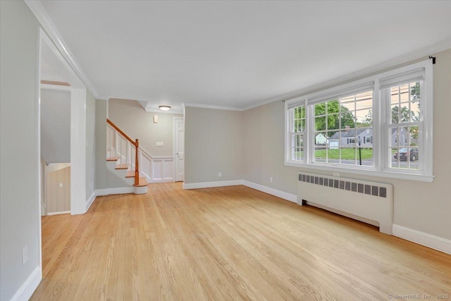 184 Goodale Dr, Newington, CT 06111 - unfurnished room featuring radiator heating unit, light wood-style floors, stairway, crown molding, and baseboards