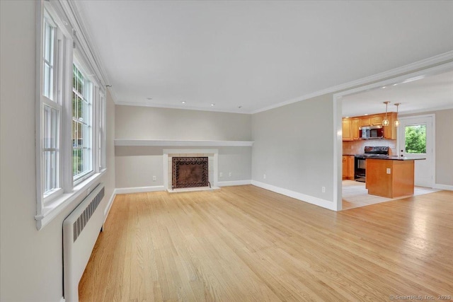 184 Goodale Dr, Newington, CT 06111 - unfurnished living room with radiator, baseboards, light wood-style flooring, a fireplace, and crown molding