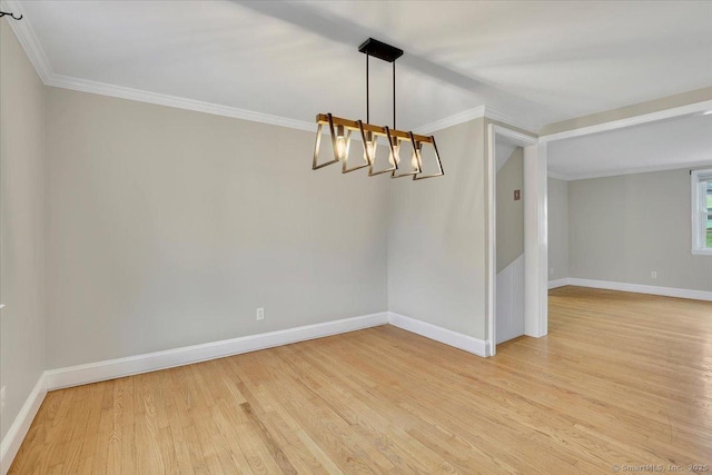 184 Goodale Dr, Newington, CT 06111 - spare room featuring light wood-type flooring, baseboards, crown molding, and a chandelier