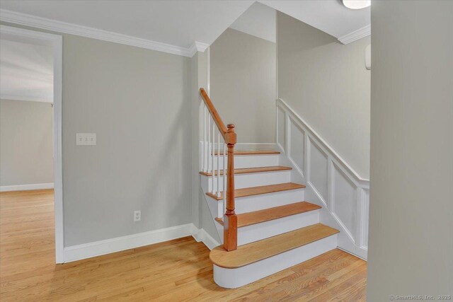 184 Goodale Dr, Newington, CT 06111 - stairway with wood finished floors, crown molding, and baseboards