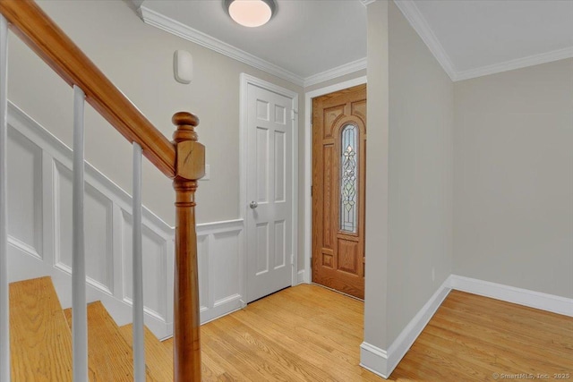 184 Goodale Dr, Newington, CT 06111 - foyer featuring light wood-style flooring, crown molding, baseboards, and stairs