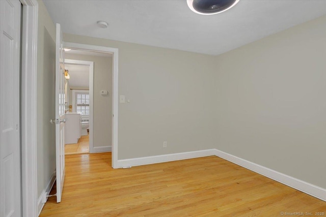 184 Goodale Dr, Newington, CT 06111 - empty room featuring light wood-style floors, baseboards, and a smoke detector