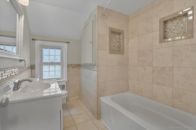 184 Goodale Dr, Newington, CT 06111 - bathroom featuring tile walls, tile patterned flooring, a tub to relax in, toilet, and vanity