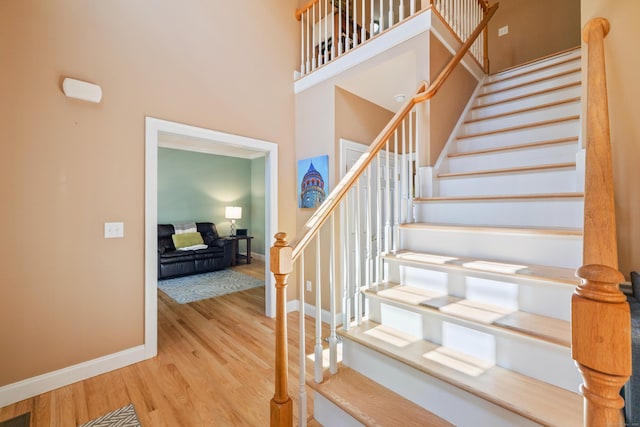 12 Everwood Dr, New Milford, CT 06776 - stairway with wood finished floors, baseboards, and a towering ceiling
