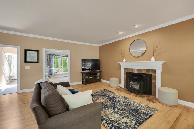 12 Everwood Dr, New Milford, CT 06776 - living room featuring wood finished floors, ornamental molding, and baseboards