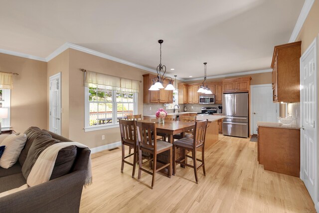 12 Everwood Dr, New Milford, CT 06776 - dining space with light wood-style flooring, crown molding, baseboards, and recessed lighting