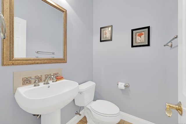 12 Everwood Dr, New Milford, CT 06776 - half bathroom featuring toilet, baseboards, a sink, and tile patterned flooring
