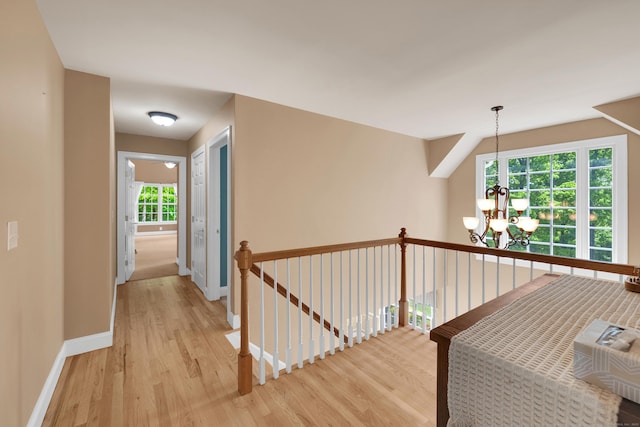12 Everwood Dr, New Milford, CT 06776 - corridor with light wood-style floors, a chandelier, an upstairs landing, and baseboards