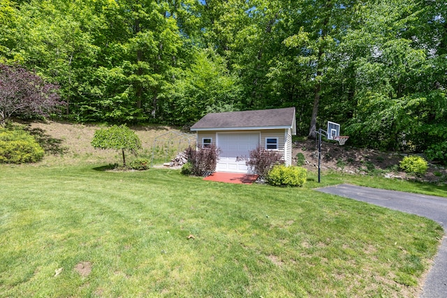 12 Everwood Dr, New Milford, CT 06776 - view of grassy yard with an outbuilding, a detached garage, and driveway