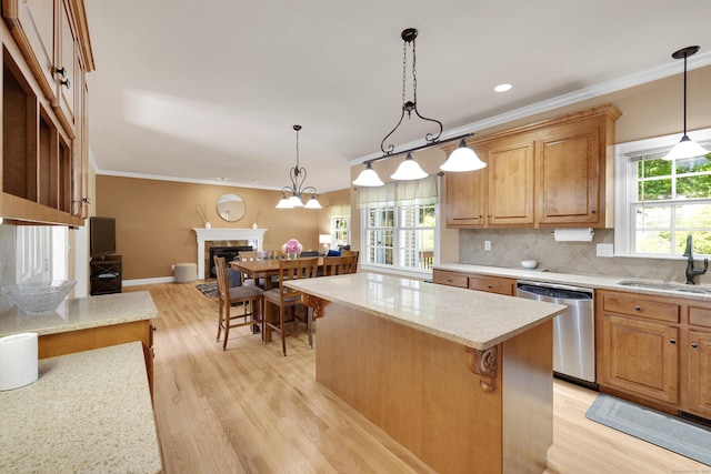 12 Everwood Dr, New Milford, CT 06776 - kitchen featuring stainless steel dishwasher, a sink, light wood finished floors, open floor plan, and ornamental molding
