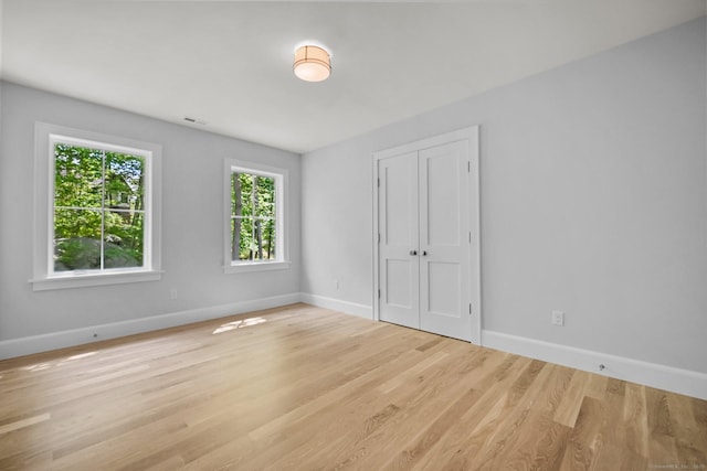 171 Compo Rd S, Westport, CT 06880 - unfurnished bedroom featuring baseboards, wood finished floors, and a closet
