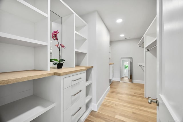 171 Compo Rd S, Westport, CT 06880 - walk in closet featuring built in study area and light wood finished floors