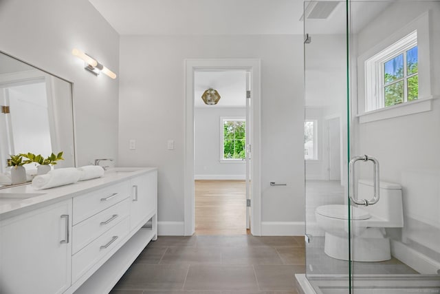 171 Compo Rd S, Westport, CT 06880 - bathroom with double vanity, baseboards, and a stall shower
