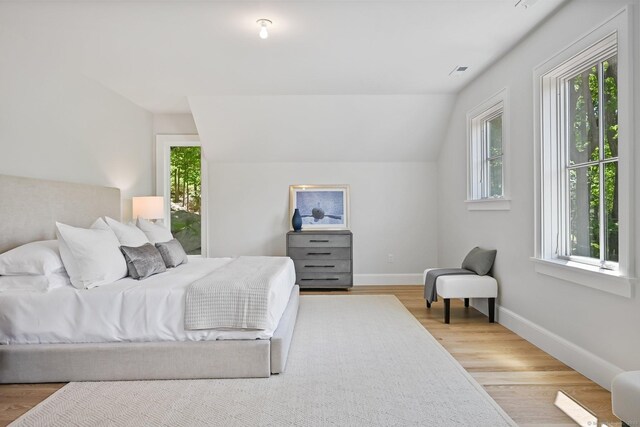 171 Compo Rd S, Westport, CT 06880 - bedroom featuring multiple windows, wood finished floors, vaulted ceiling, and baseboards