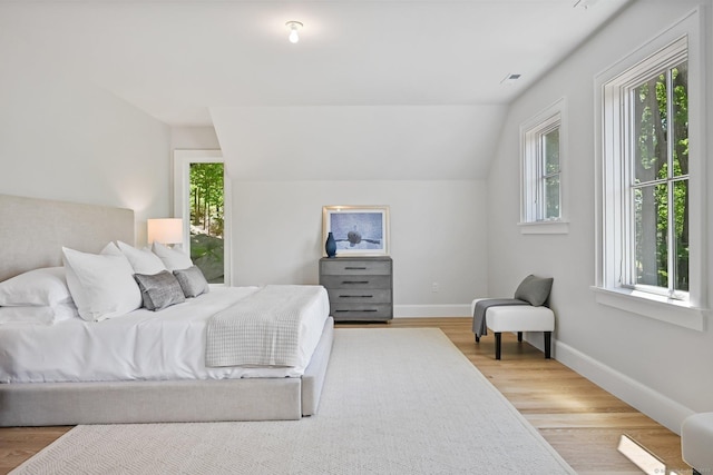 171 Compo Rd S, Westport, CT 06880 - bedroom featuring multiple windows, wood finished floors, and vaulted ceiling