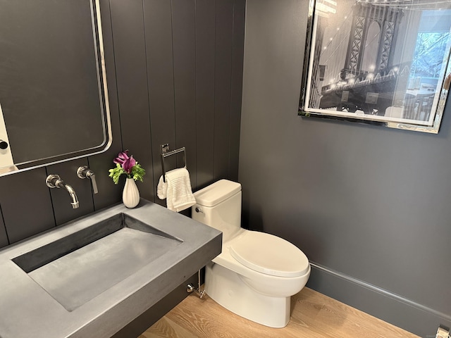 171 Compo Rd S, Westport, CT 06880 - bathroom featuring toilet, wood finished floors, a sink, and baseboards