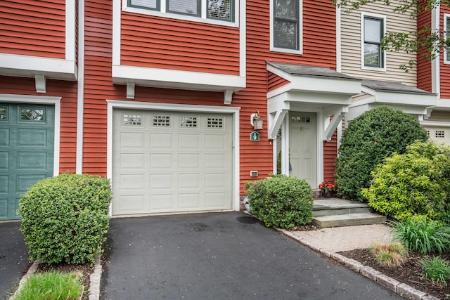 645 Prospect Ave Unit 9, West Hartford, CT 06105 - doorway to property with an attached garage and driveway